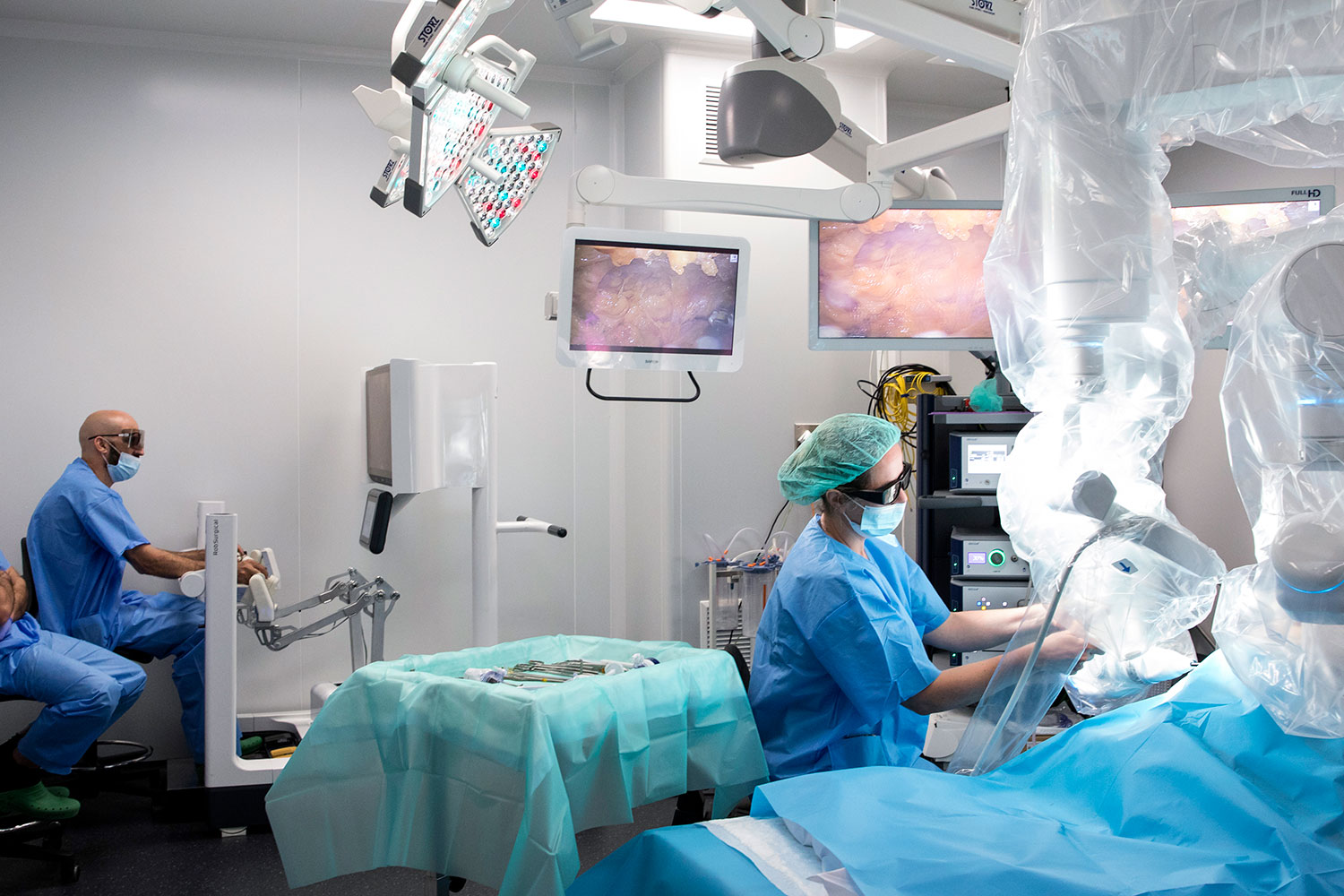 Surgeons operating with Rob Surgical's surgical robot